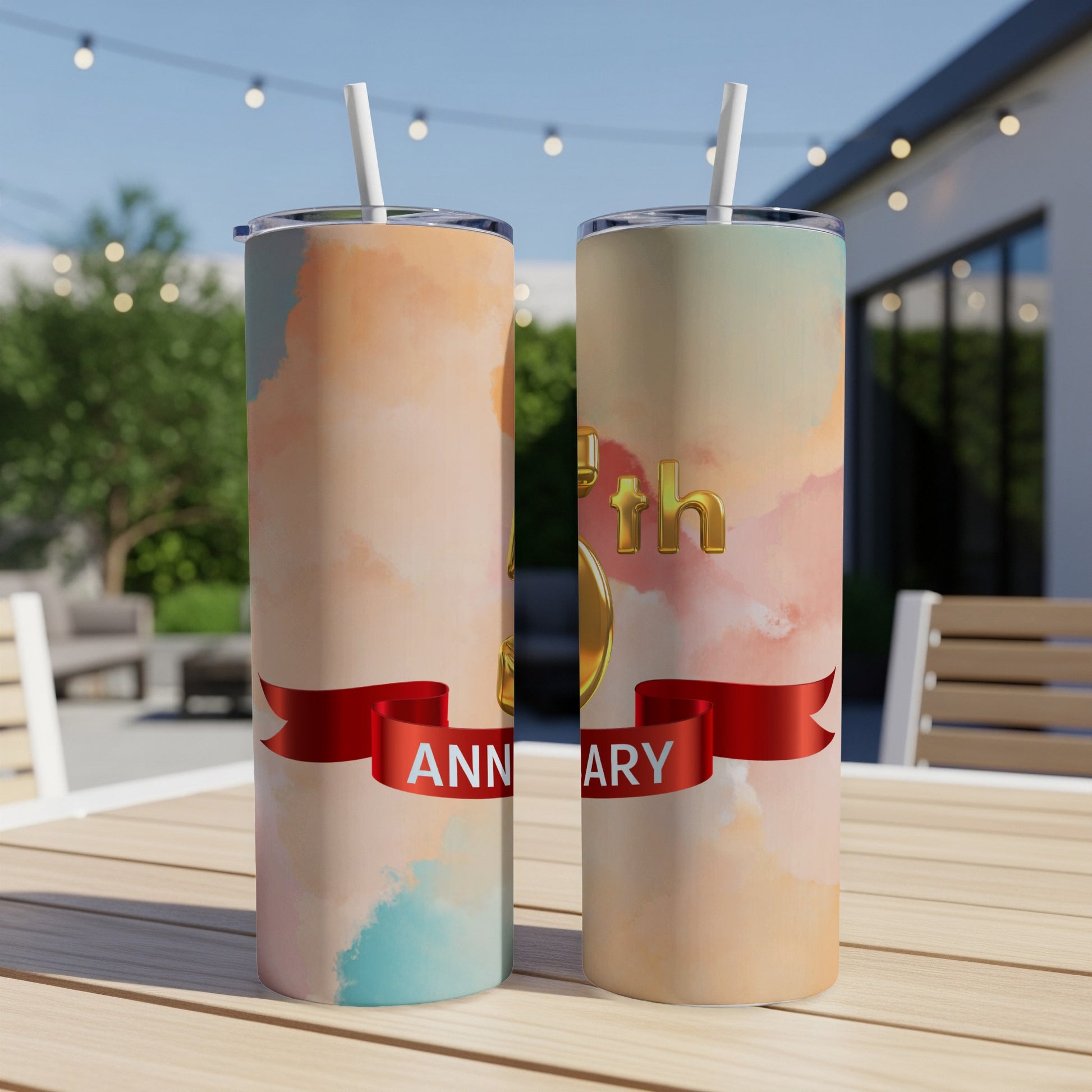 Two tumblers with pastel watercolor backgrounds and "50th Anniversary" text on a ribbon.