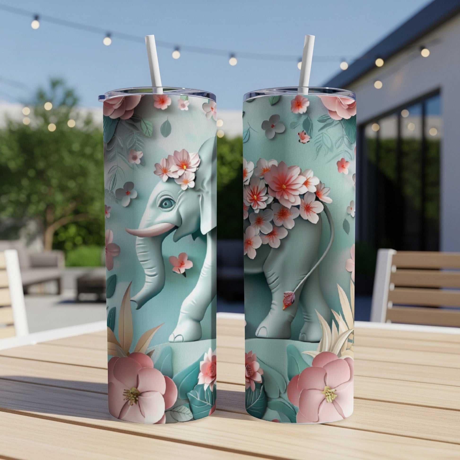 Teal tumbler with floral elephant design.