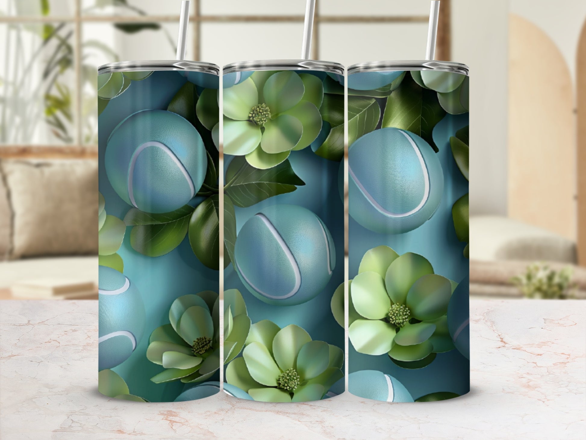 Three tall tumblers with a repeating pattern of tennis balls and green flowers.