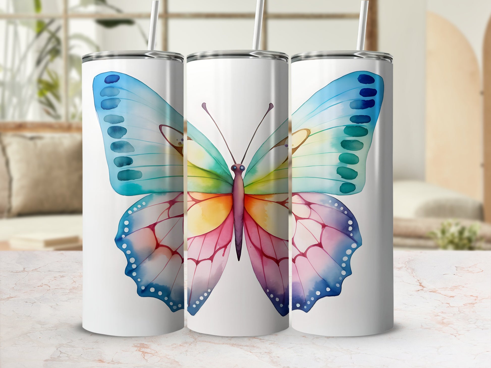 White tumbler with watercolor butterfly design in rainbow colors.