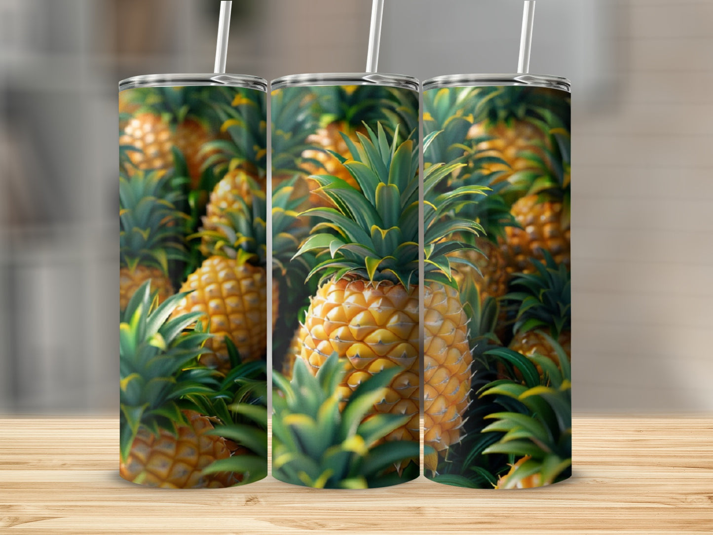 Three tumblers decorated with a repeating pattern of ripe pineapples.
