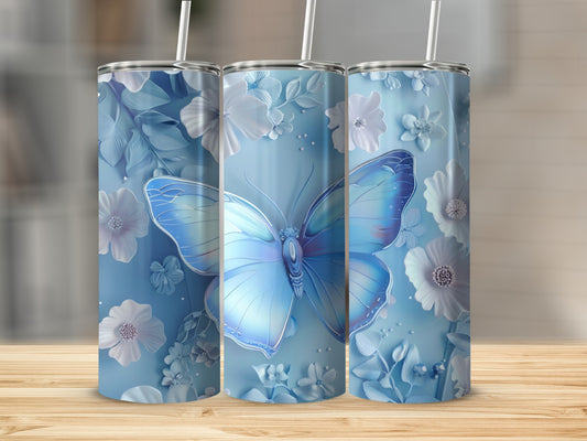 Three blue tumblers with butterfly and floral designs.