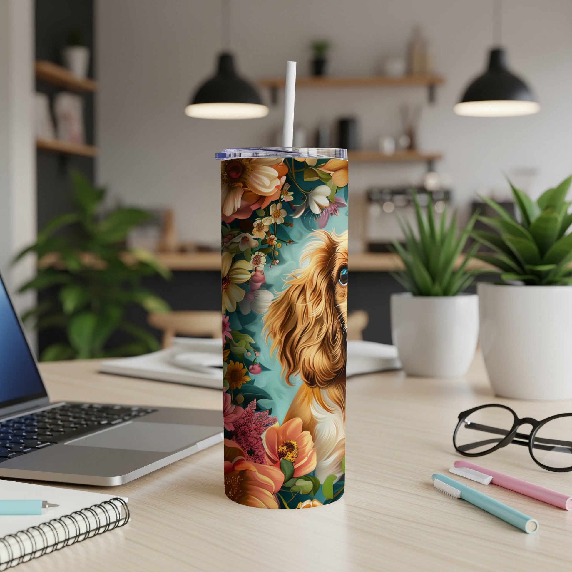 Cavalier King Charles Spaniel in floral pattern on a tumbler with desk items.