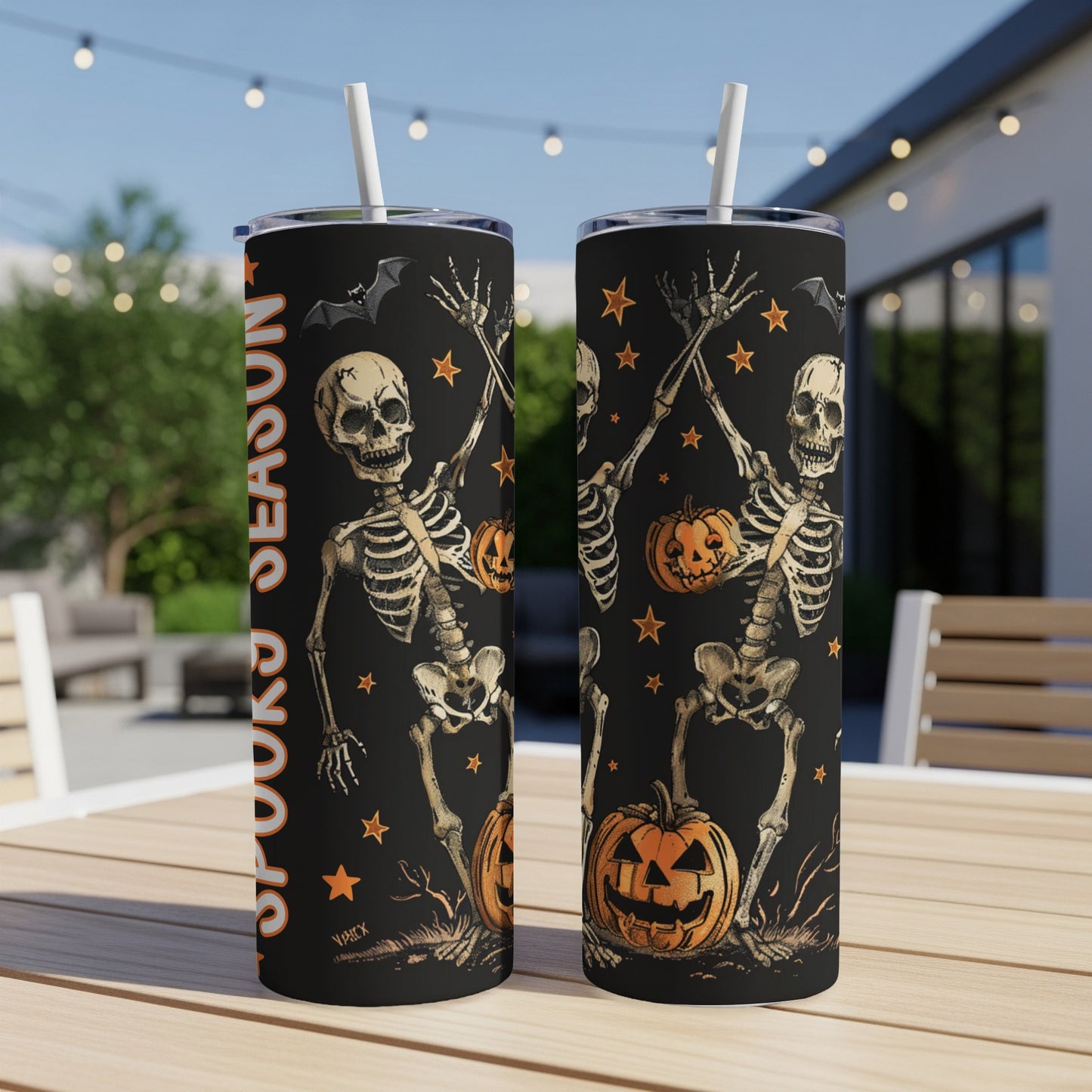 Black tumbler with skeletons and pumpkins, reading "Spooky Season"