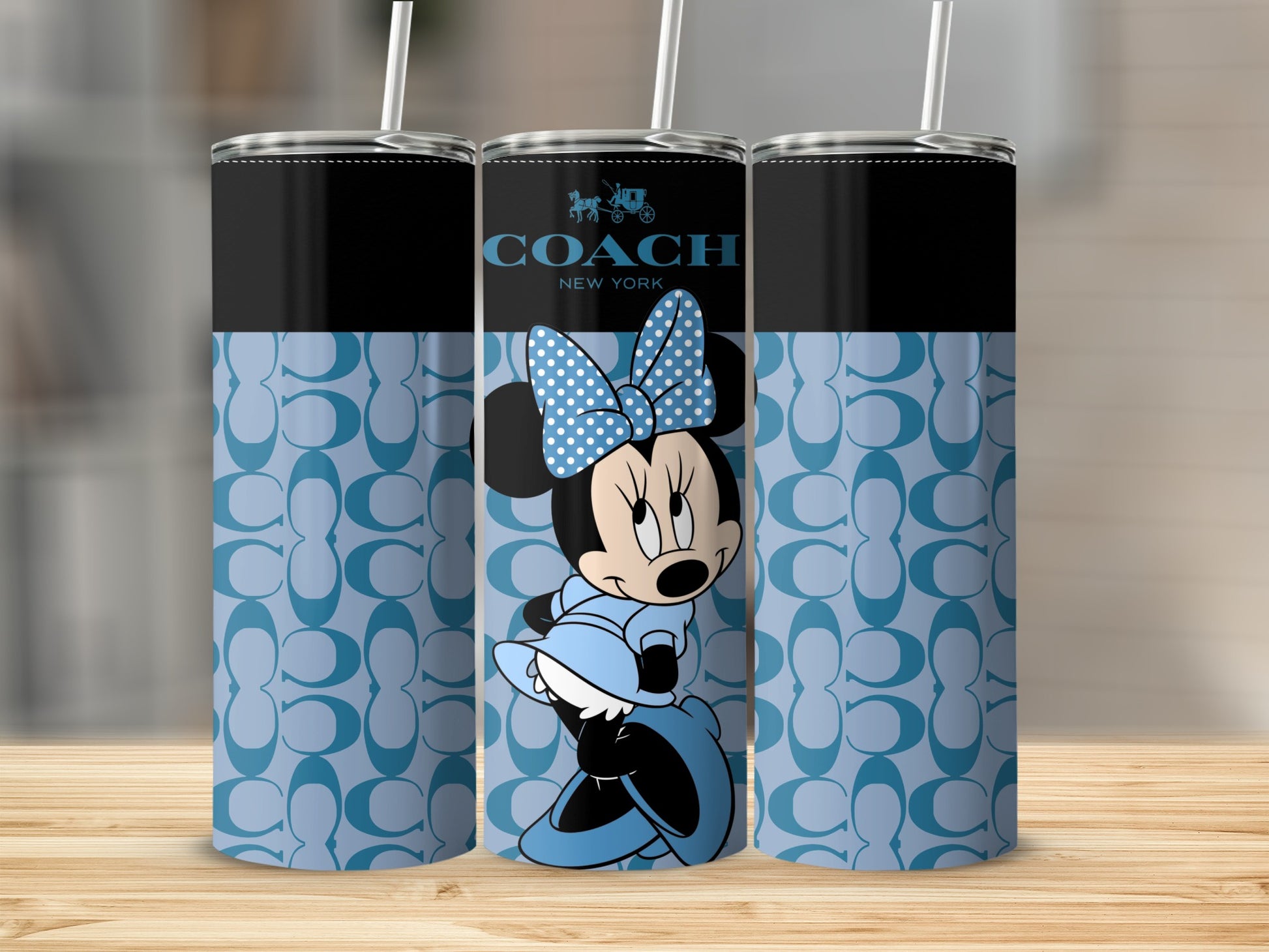 Coach New York tumblers featuring Minnie Mouse in a light blue dress and polka dot bow.