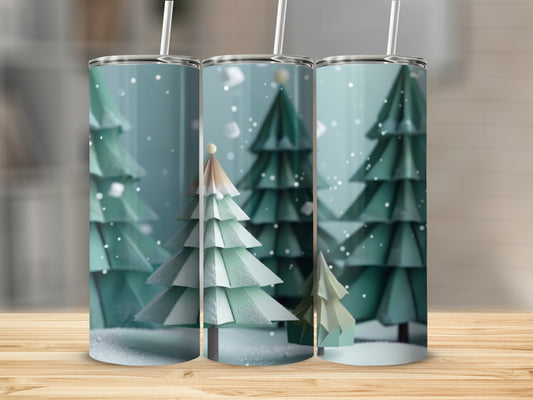 Three green pine trees with falling snow on a wooden surface.