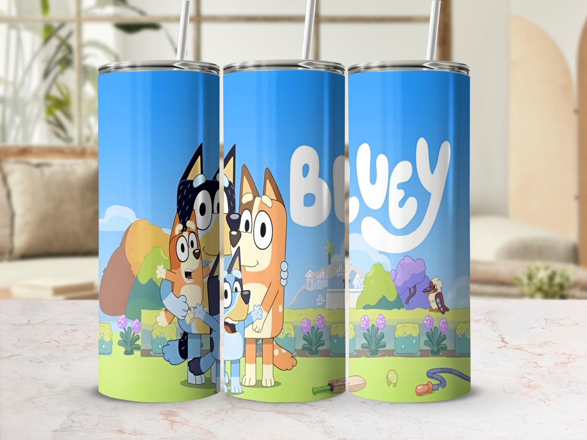Bluey and Bingo characters on a blue tumbler with pastel background.