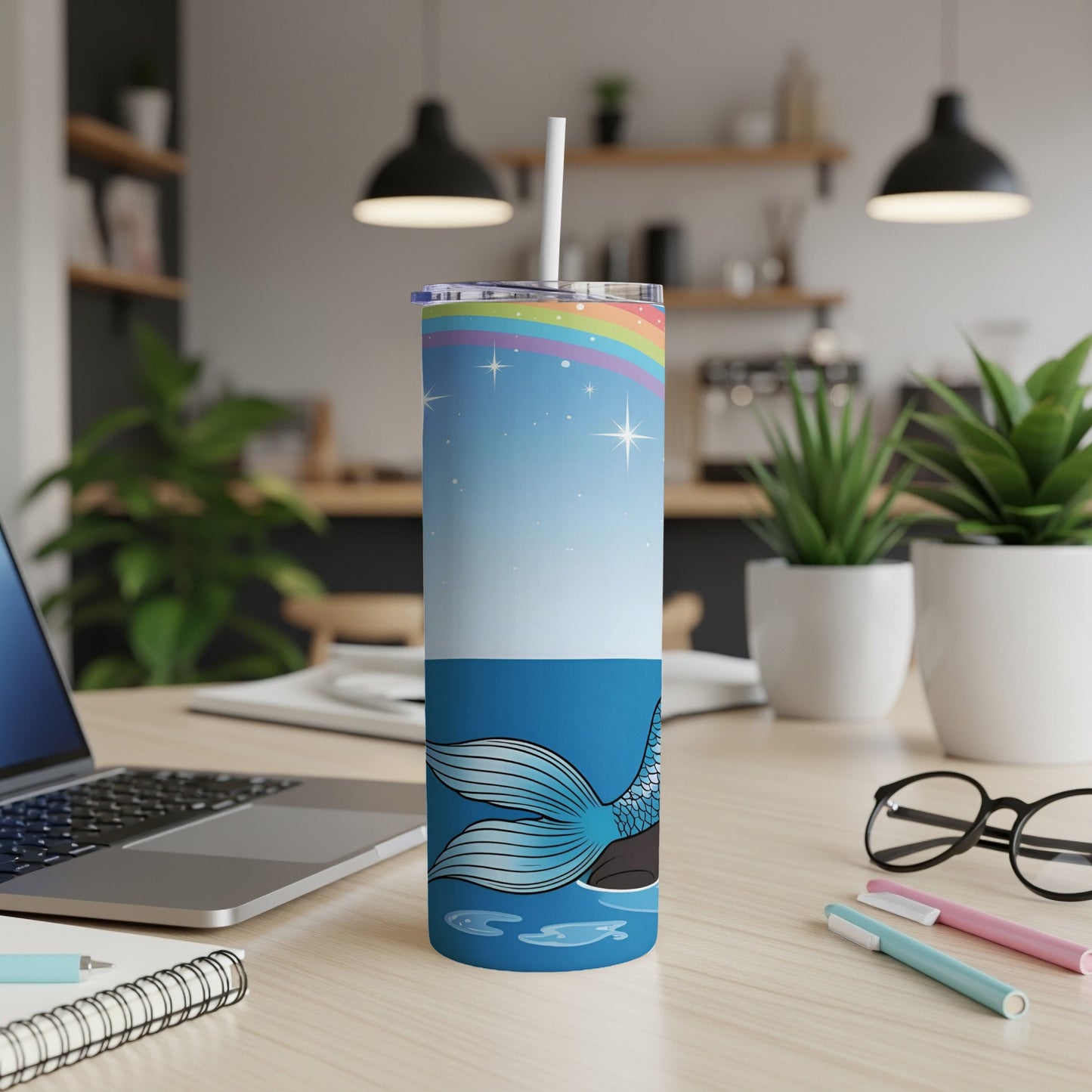 Tall tumbler with mermaid tail and rainbow design.