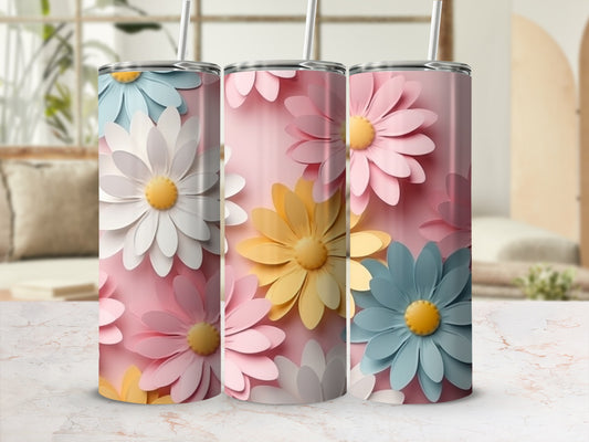 Pink tumbler with repeating floral pattern in pastel blue, yellow, and pink.