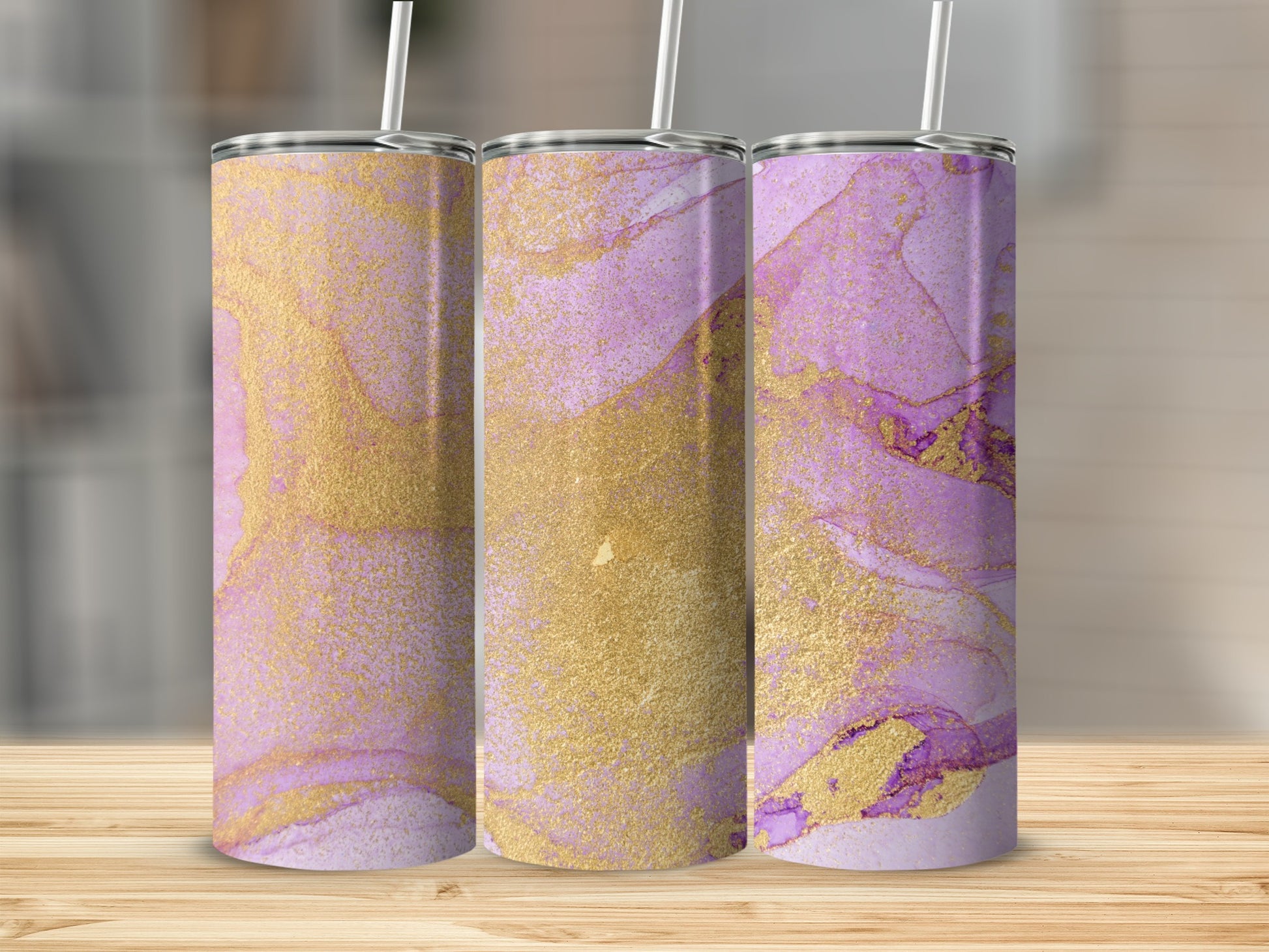 Three tumblers with a purple and gold abstract marble design.