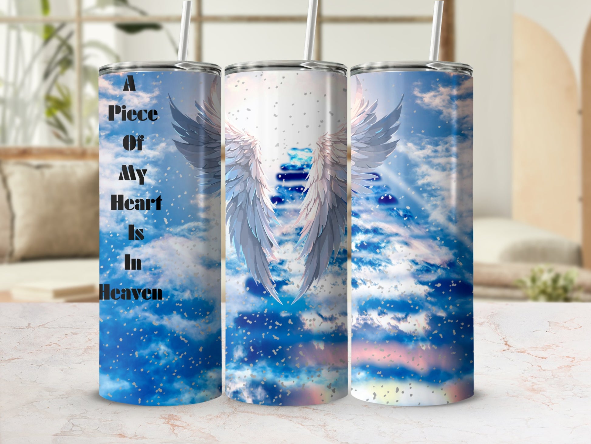 Tumbler with angel wings and "A Piece Of My Heart Is In Heaven" text.