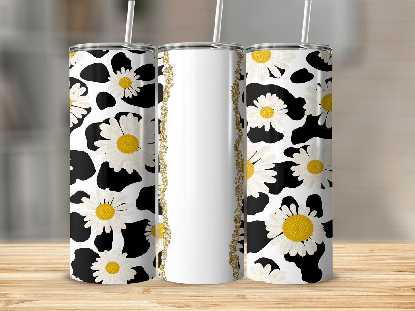White and black cow print tumbler with daisies and gold glitter accent.