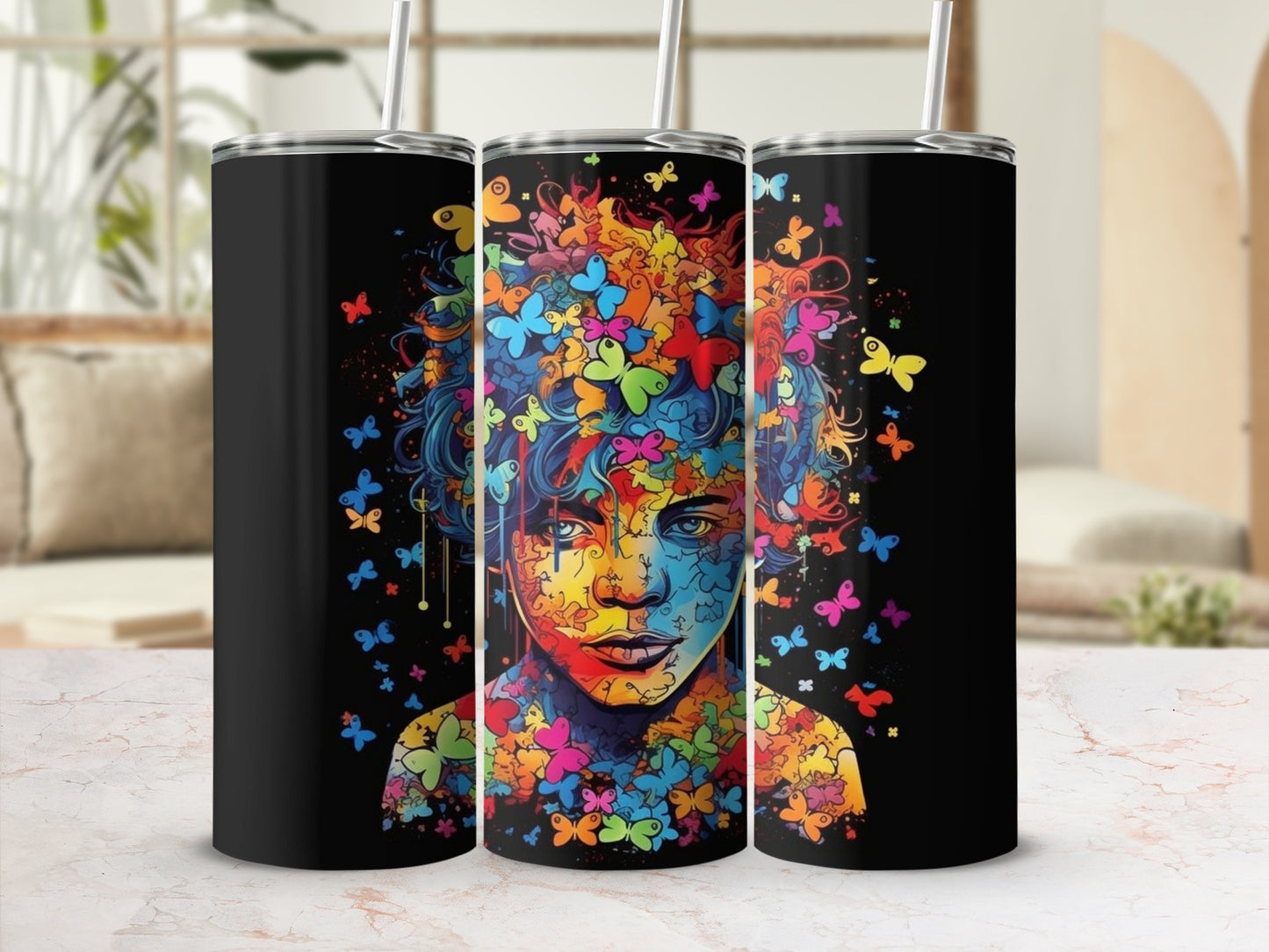 Tumbler featuring a colorful portrait of a person surrounded by abstract butterflies.