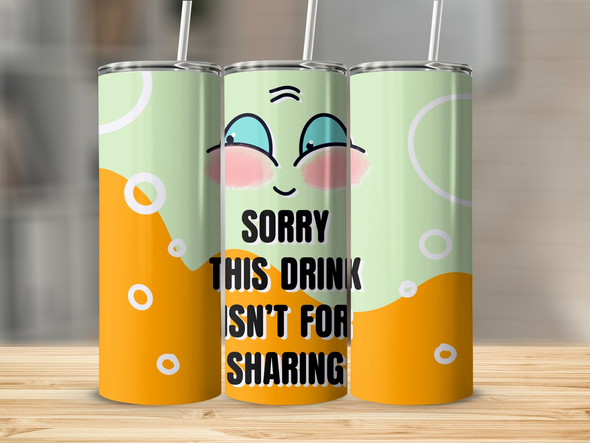 Mint green tumbler with orange base, cartoon eyes, and "Sorry this drink isn't for sharing" text.