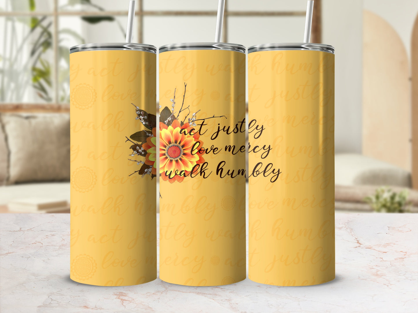 Yellow tumbler with "act justly love mercy walk humbly" text and floral design.