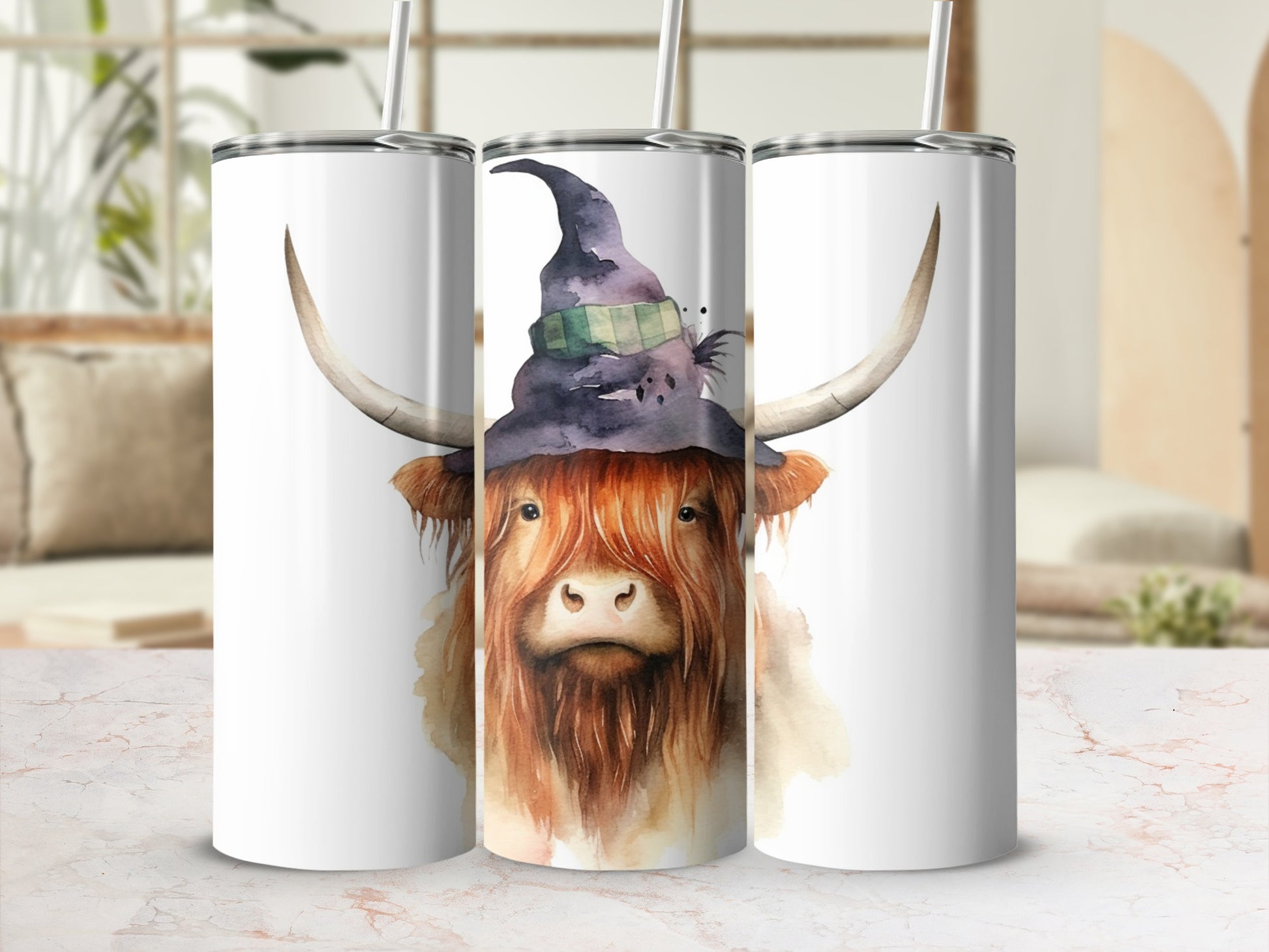 Highland cow wearing witch hat on a tumbler.