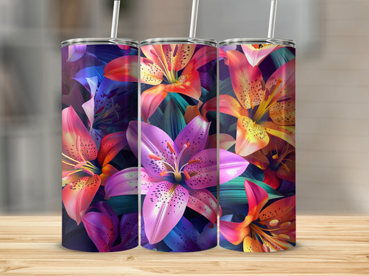 Three tumblers with vibrant floral lily designs on a wooden surface.