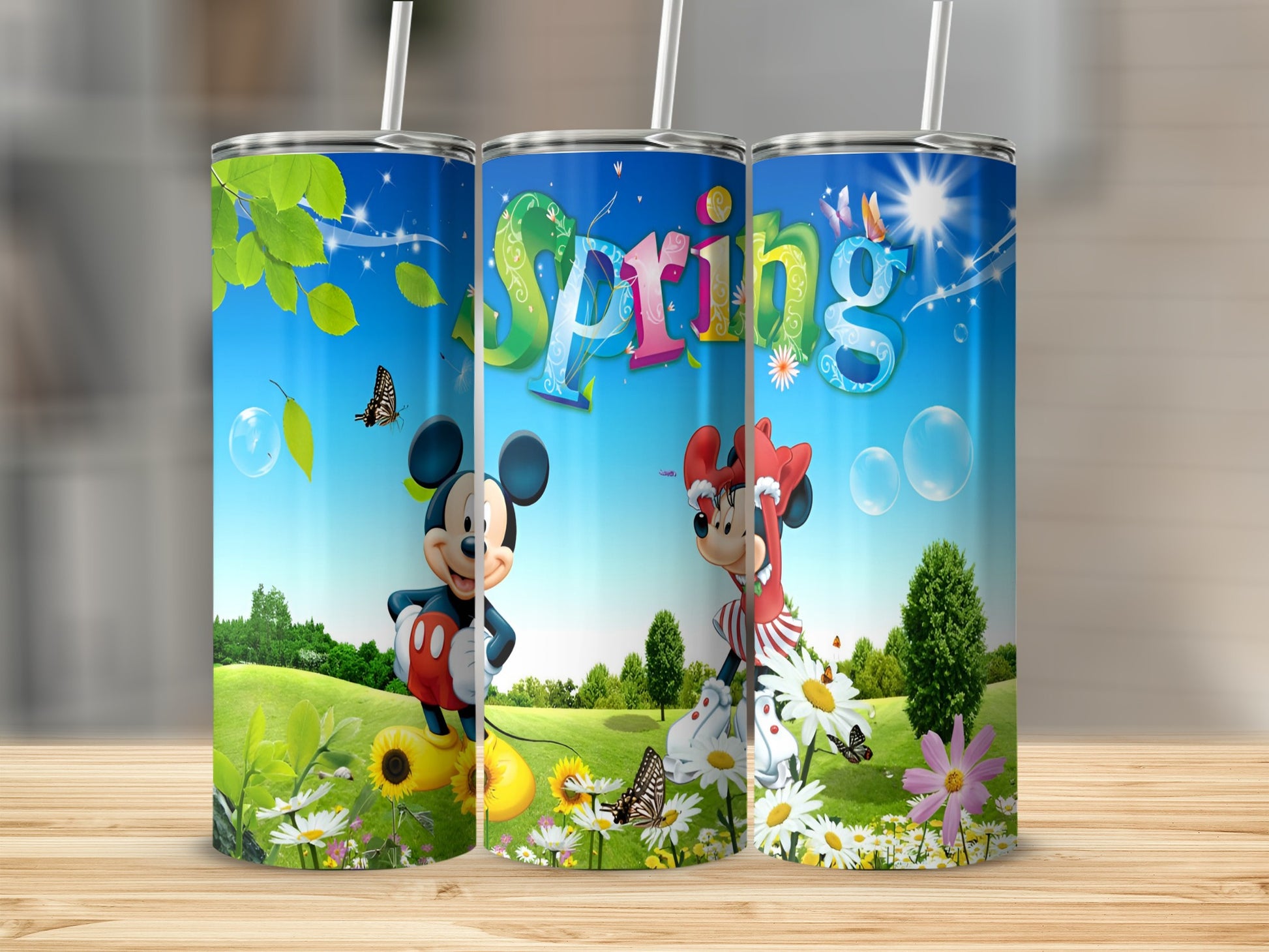 Mickey and Minnie Mouse spring tumblers with "Spring" text and butterflies.