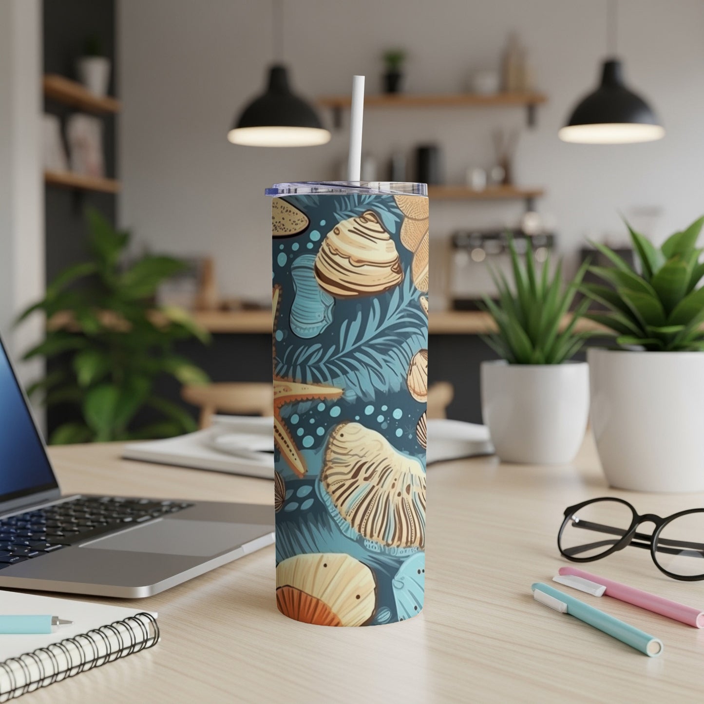 Tall tumbler with seashells and palm leaves pattern.