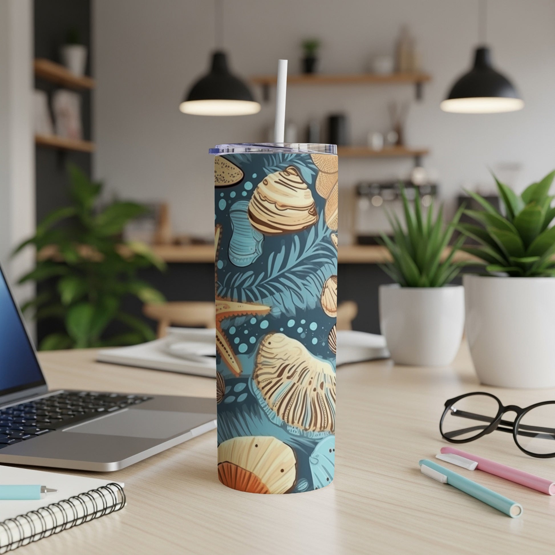 Tall tumbler with seashells and palm leaves pattern.