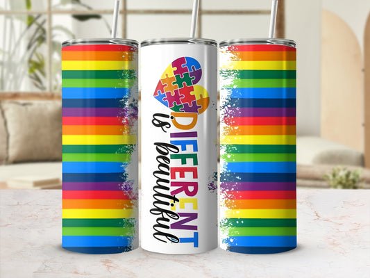 Rainbow tumbler with "Different is Beautiful" text and puzzle heart.