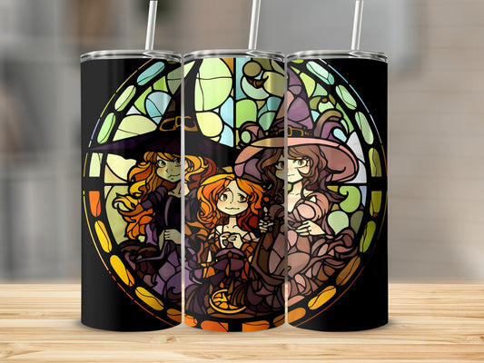 Three witches in colorful robes against a stained-glass window.