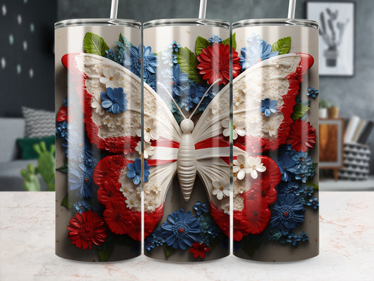 White butterfly with red and blue floral accents on a patterned tumbler.
