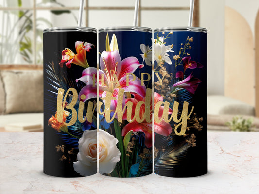 Black tumbler with "Happy Birthday" in gold glitter over floral arrangement.