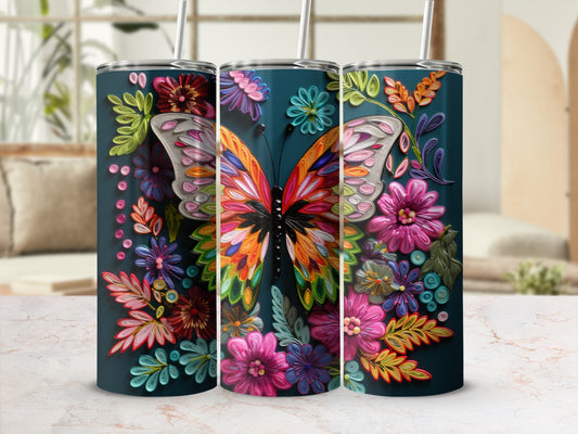 Dark teal tumbler with colorful butterfly and floral designs.