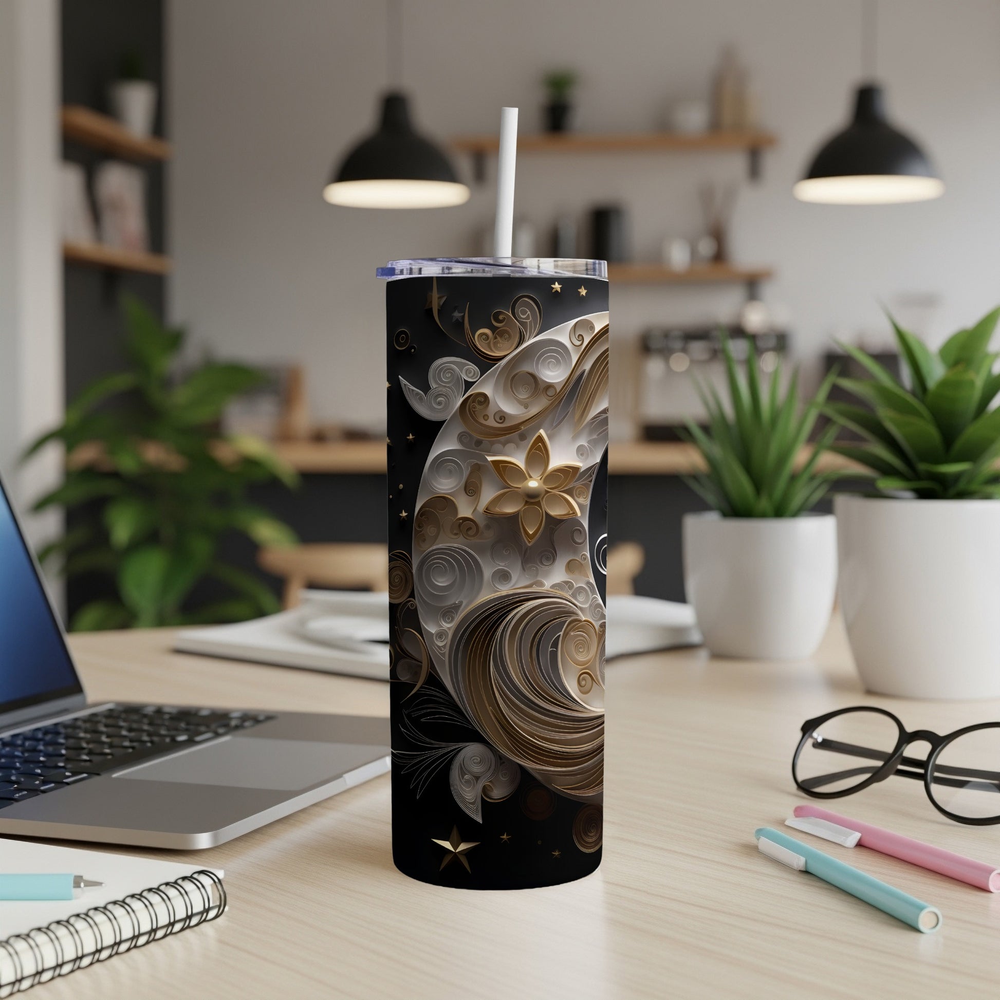 Black tumbler with gold celestial moon and stars design.