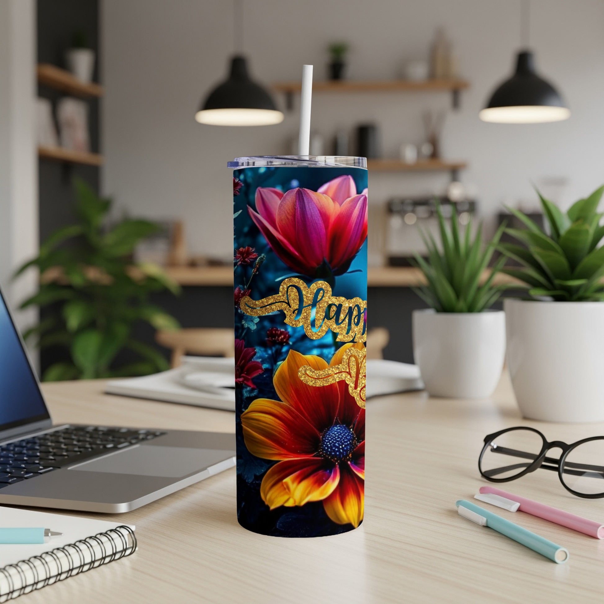 Floral tumbler with "Happy New Year" text on a desk.