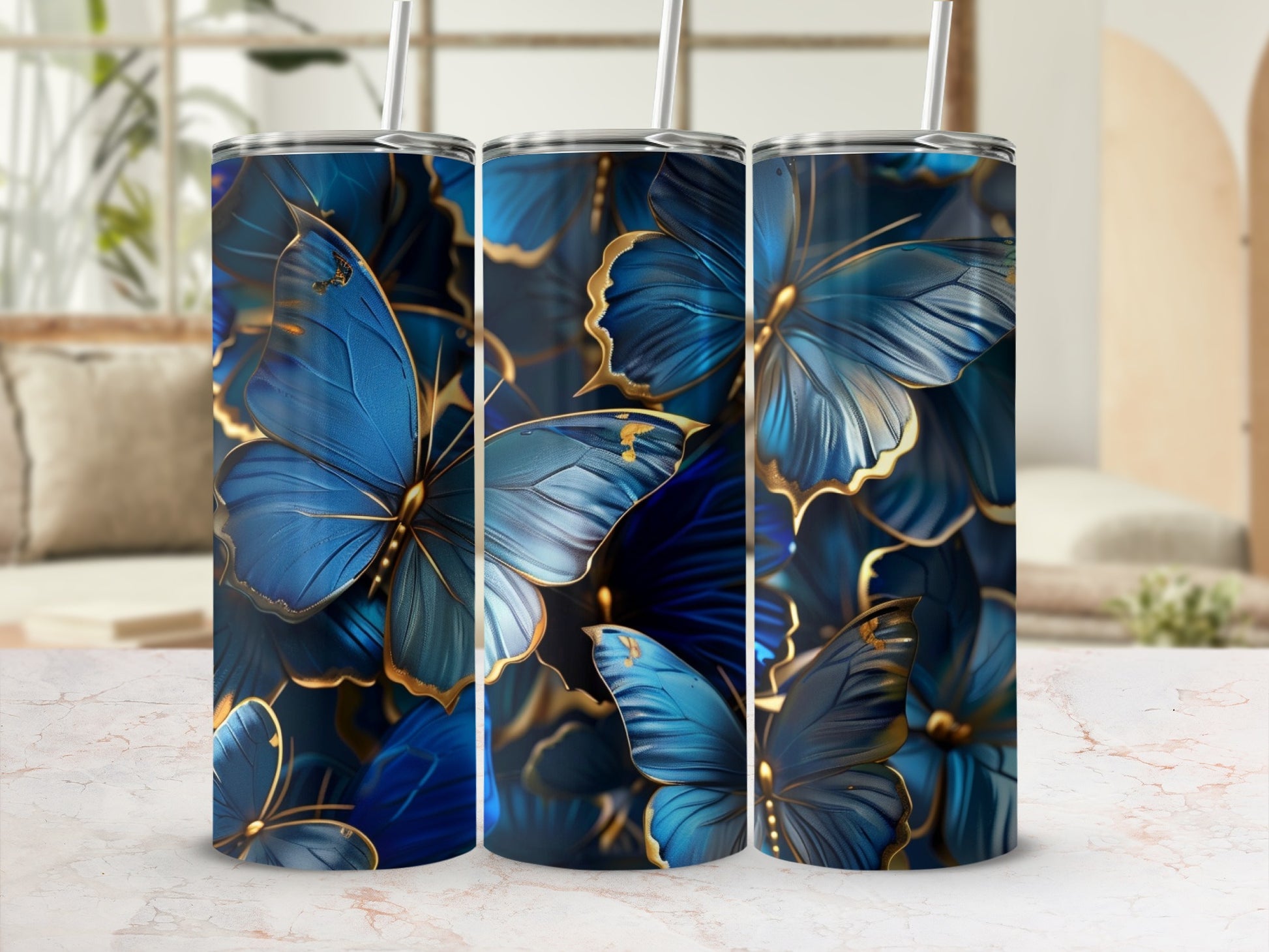 Three tumblers with blue and gold butterfly pattern.
