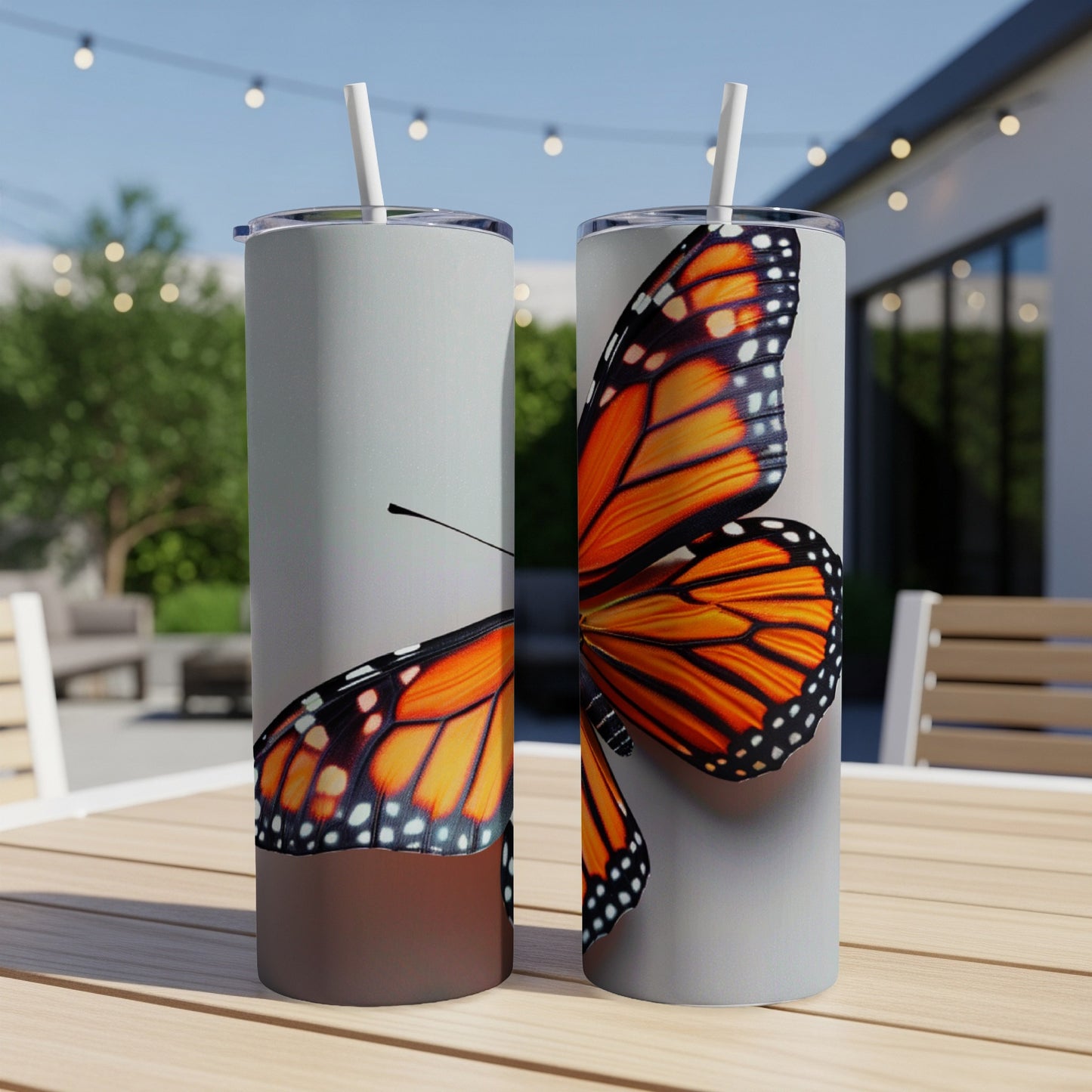 Two tumblers with a close-up of a monarch butterfly wing design.