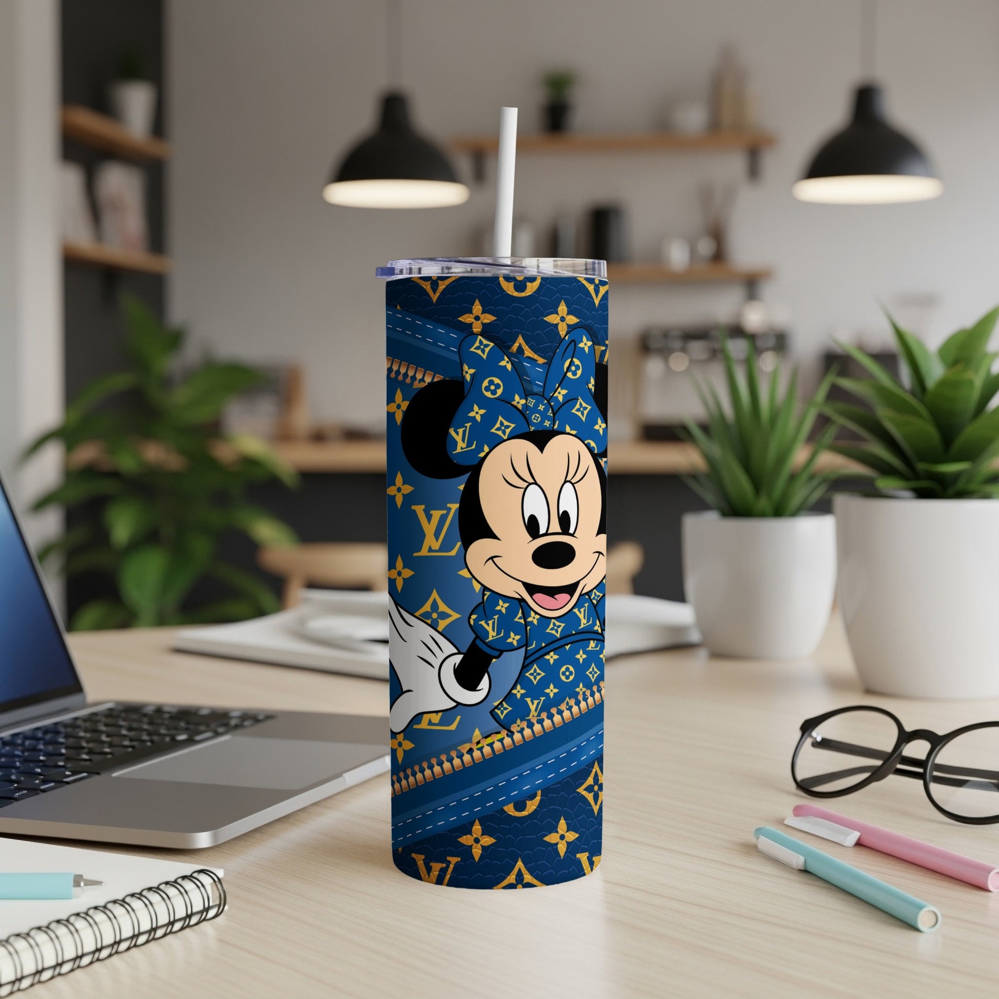Minnie Mouse on a navy blue tumbler with gold LV pattern.