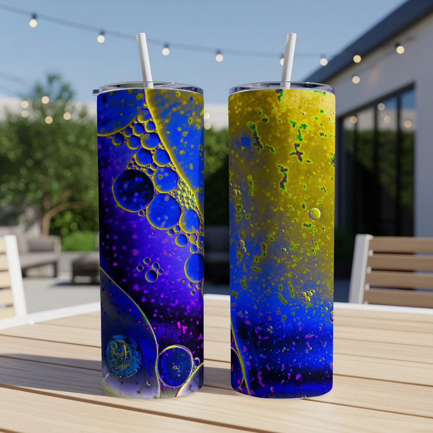 Two tall tumblers with abstract blue, purple, and yellow bubbly patterns.