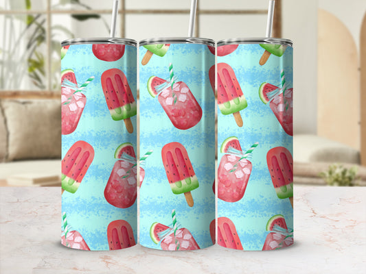 Patterned tumbler with watermelon popsicles and ice cubes on a light blue background.