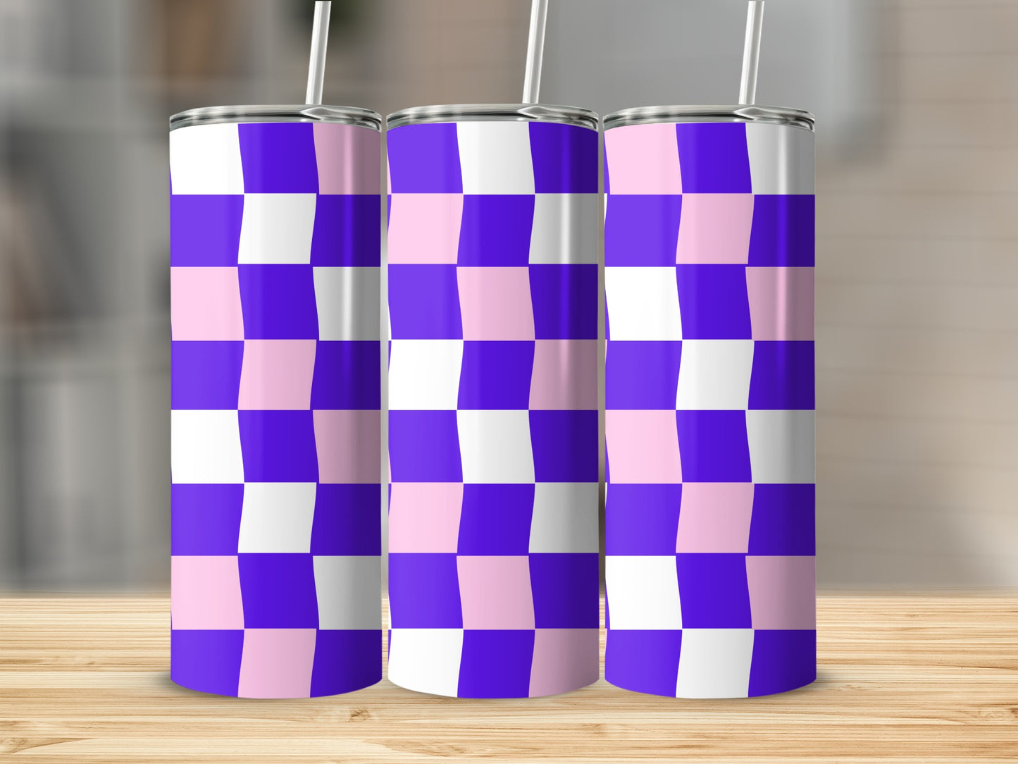 Three tall tumblers with a purple and pink checkered pattern.