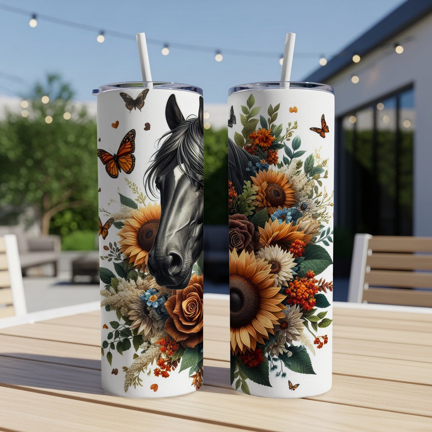 Horse's head and floral design on two white tumblers with straws.