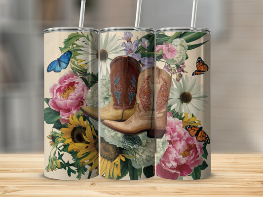 Cowboy boots and flowers on a tumbler, with butterflies.