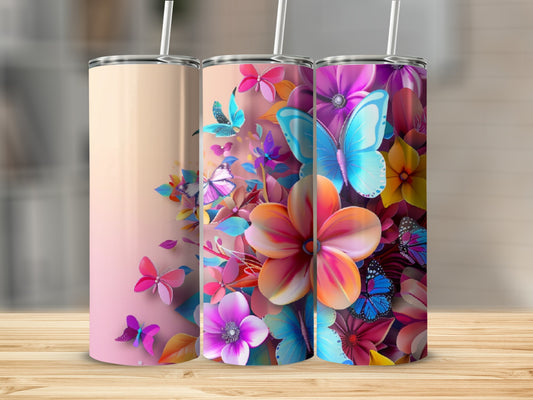 Three tall, thin tumblers adorned with colorful flowers and butterflies.