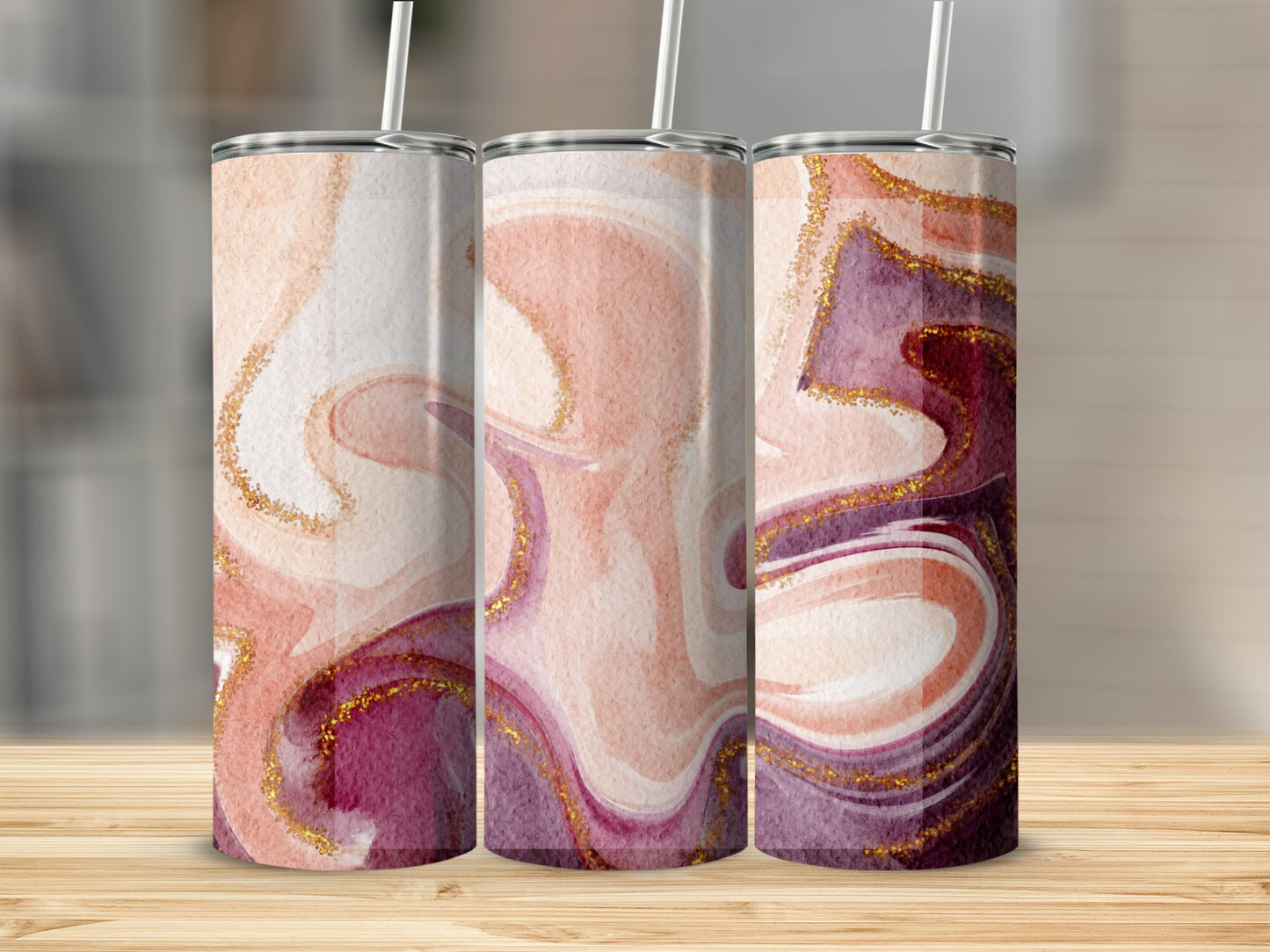 Three tumblers with marbled pink, purple, and gold glitter patterns.