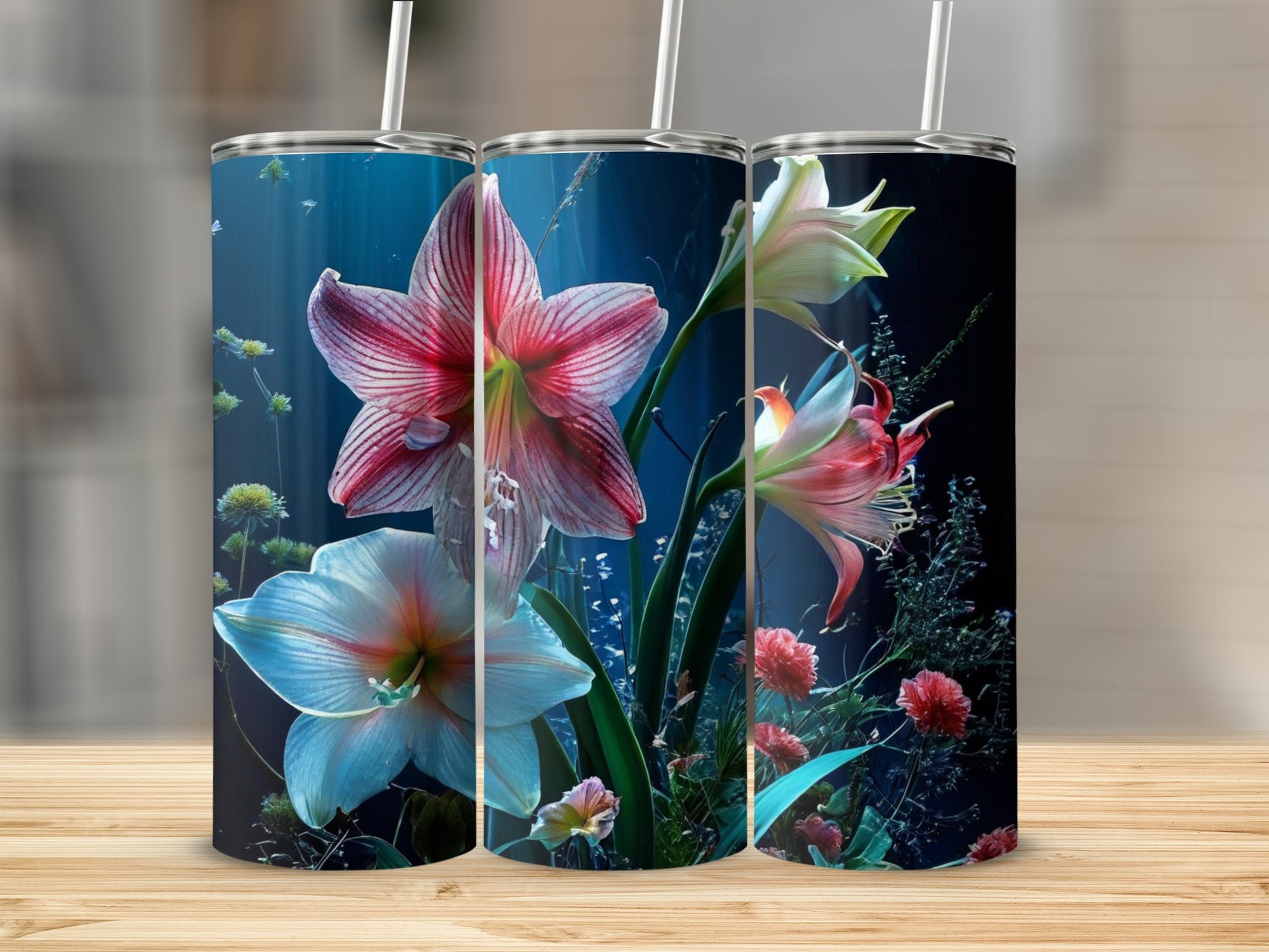 Three tumblers display vibrant floral underwater scenes with pink and white lilies.