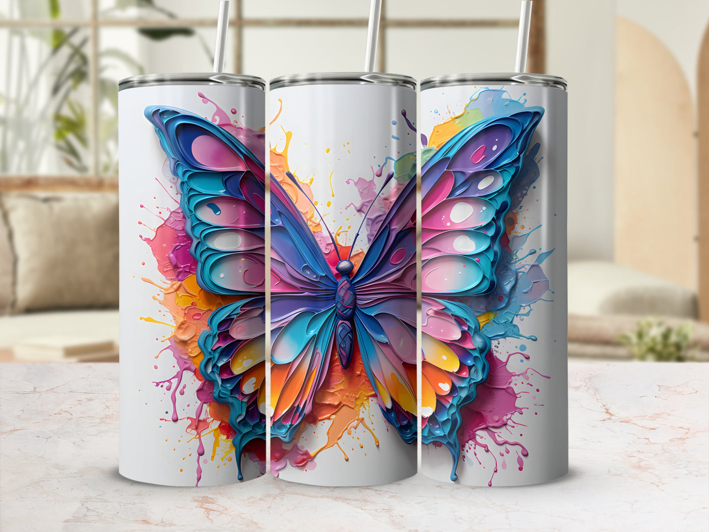 Three tumblers with colorful butterfly watercolor splatters.