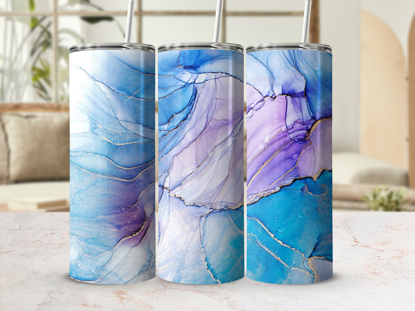 Three tumblers with swirling blue, purple, and gold abstract patterns.