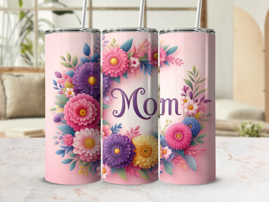 Pink tumbler with floral design and "Mom" text.