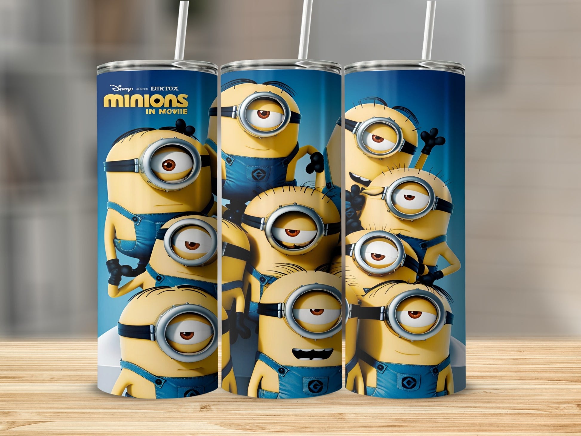 Minions from Despicable Me movie on a blue tumbler with straw.