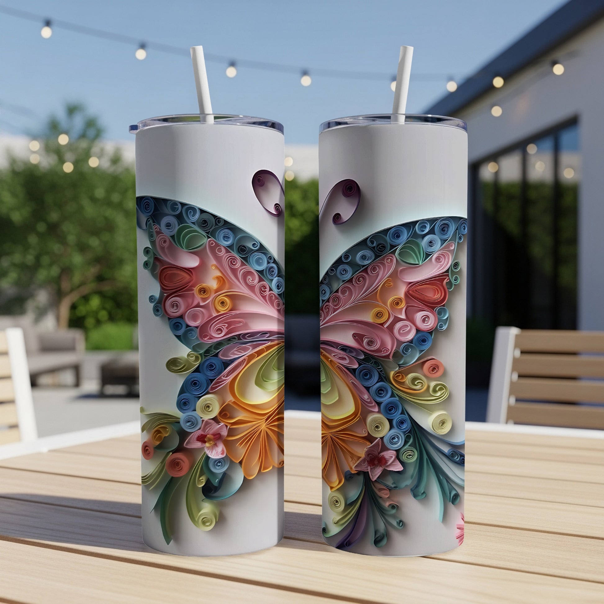 Two tall white tumblers with a colorful quilled paper butterfly design.