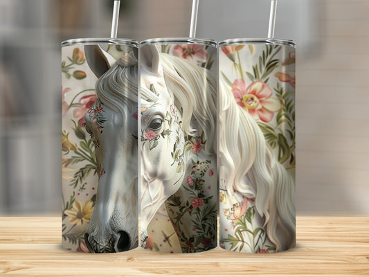 White horse head with floral designs on a floral patterned tumbler.