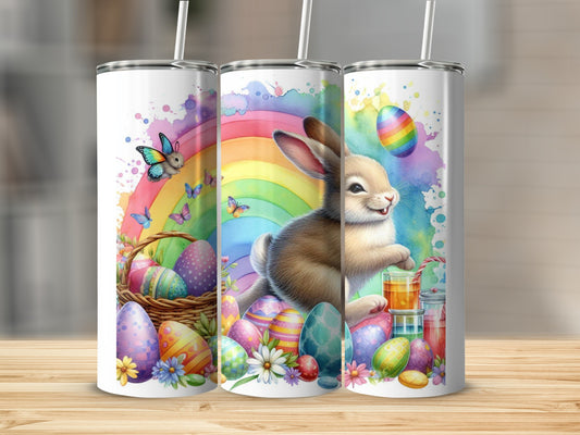 Easter bunny, rainbow, colorful eggs, and butterflies on a skinny tumbler.