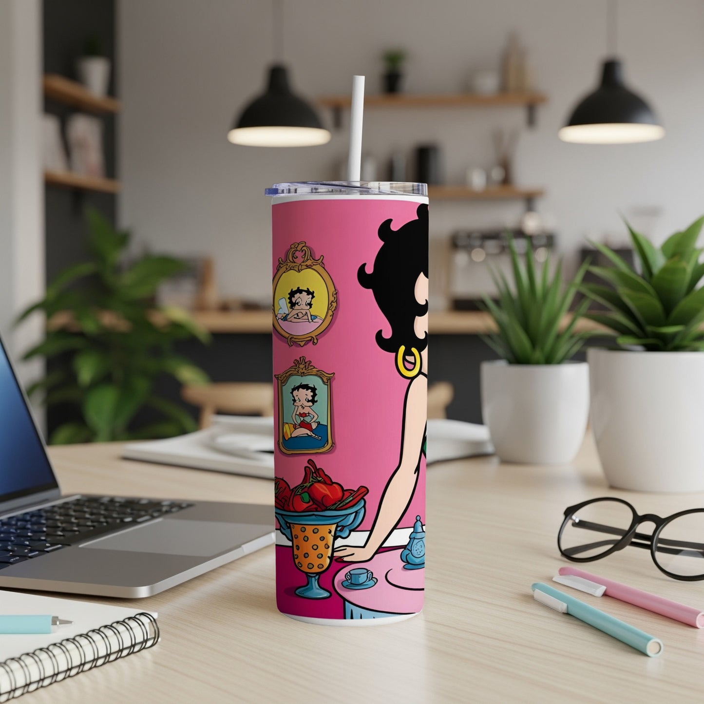 Betty Boop illustration on a pink tumbler with a straw.